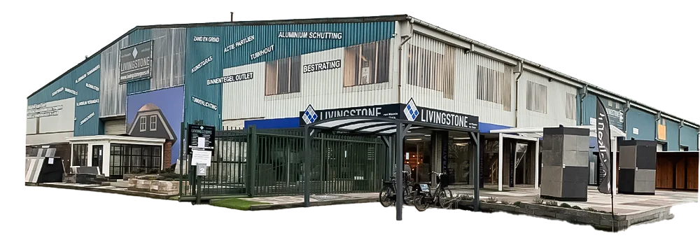 Bestrating Zuid-holland De gevel van de Livingstone showroom met een buitenterrein vol tuinmaterialen, waaronder bestrating, schuttingen, tuinhout en kunstgras.